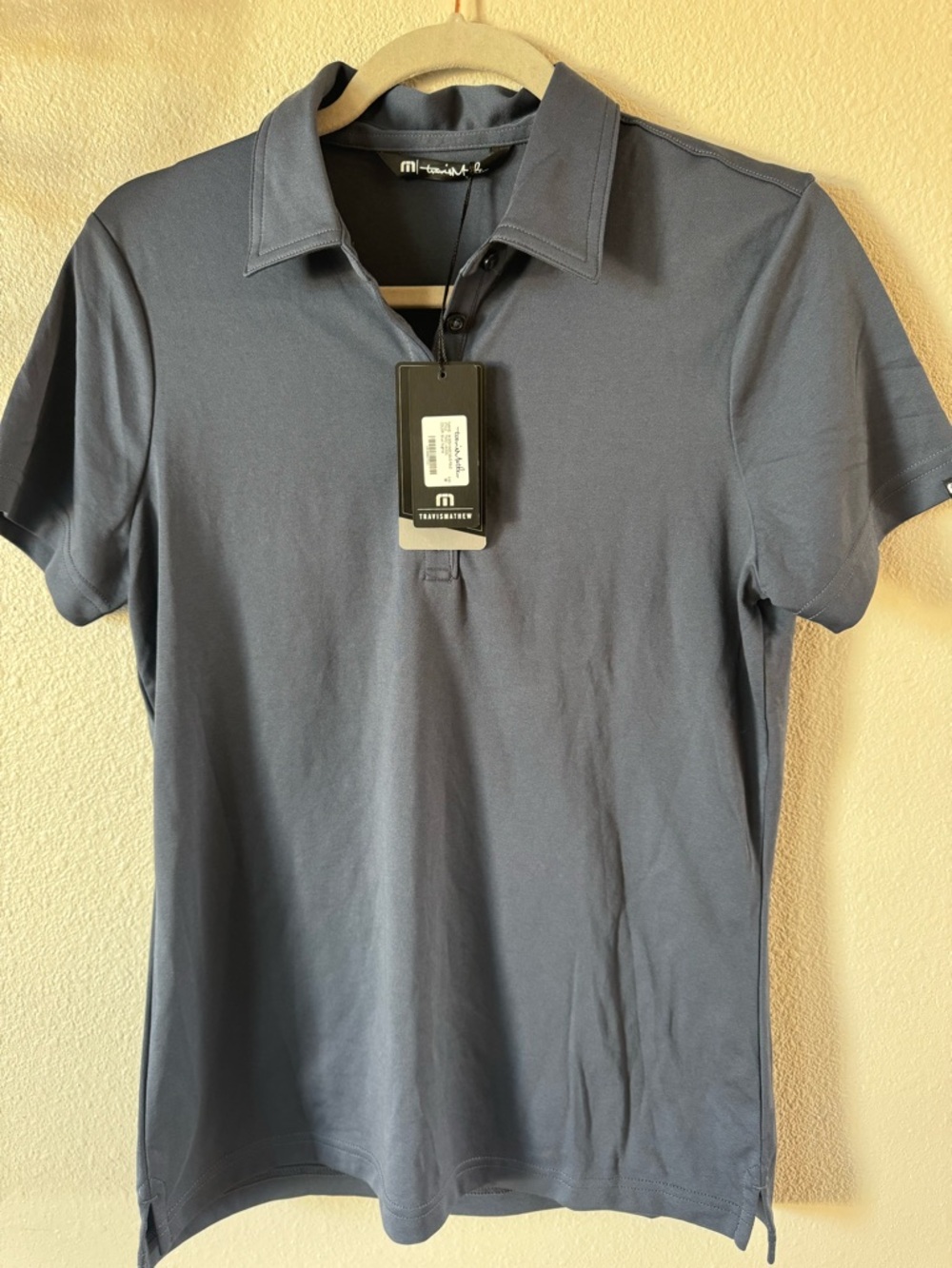 Travis Matthew’s Women’s blue golf shirt. Size M
